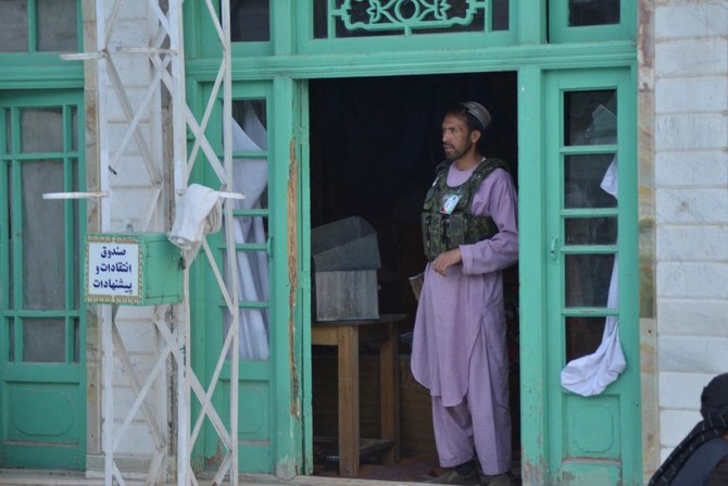 A gunman kills 6 worshippers inside a Shiite mosque in western Afghanistan, the Taliban say